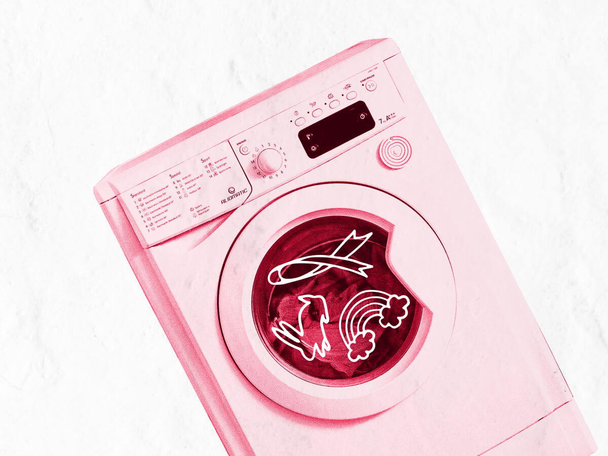 A washing machine with symbols inside: a cancer pink ribbon, a pride rainbow and a cruelty free rabbit